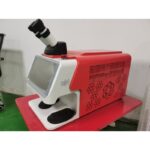 Desktop jewelry laser welding machine red cabinet side view